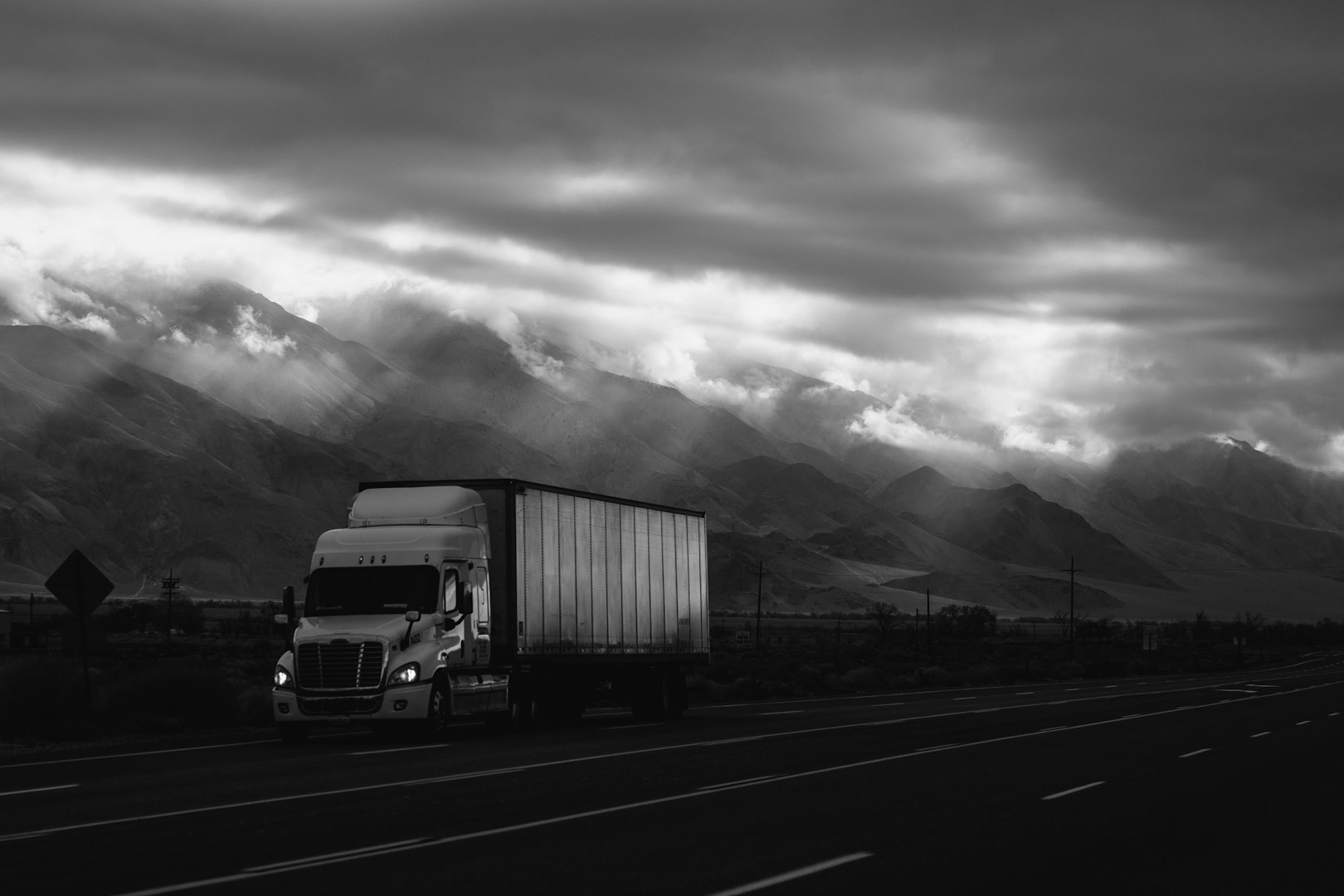 Close-up of a shiny black semi-truck